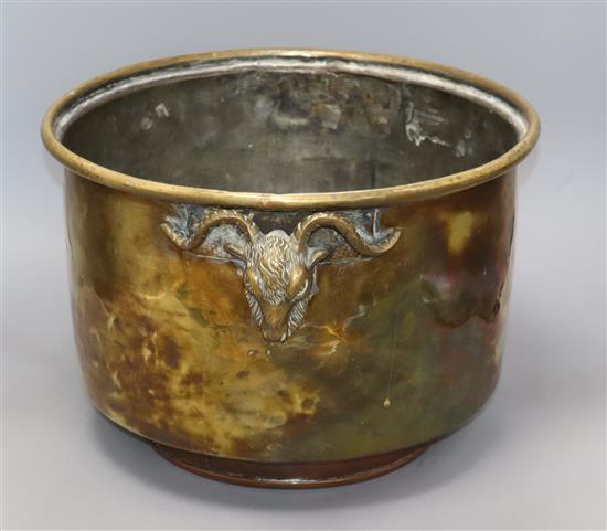 A brass jardiniere with rams head mounts diameter 37cm
